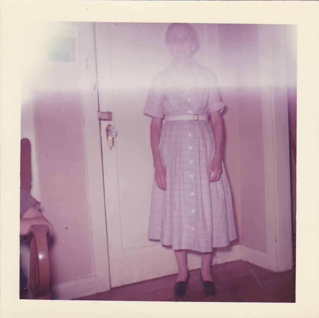 Annie standing inside near the door