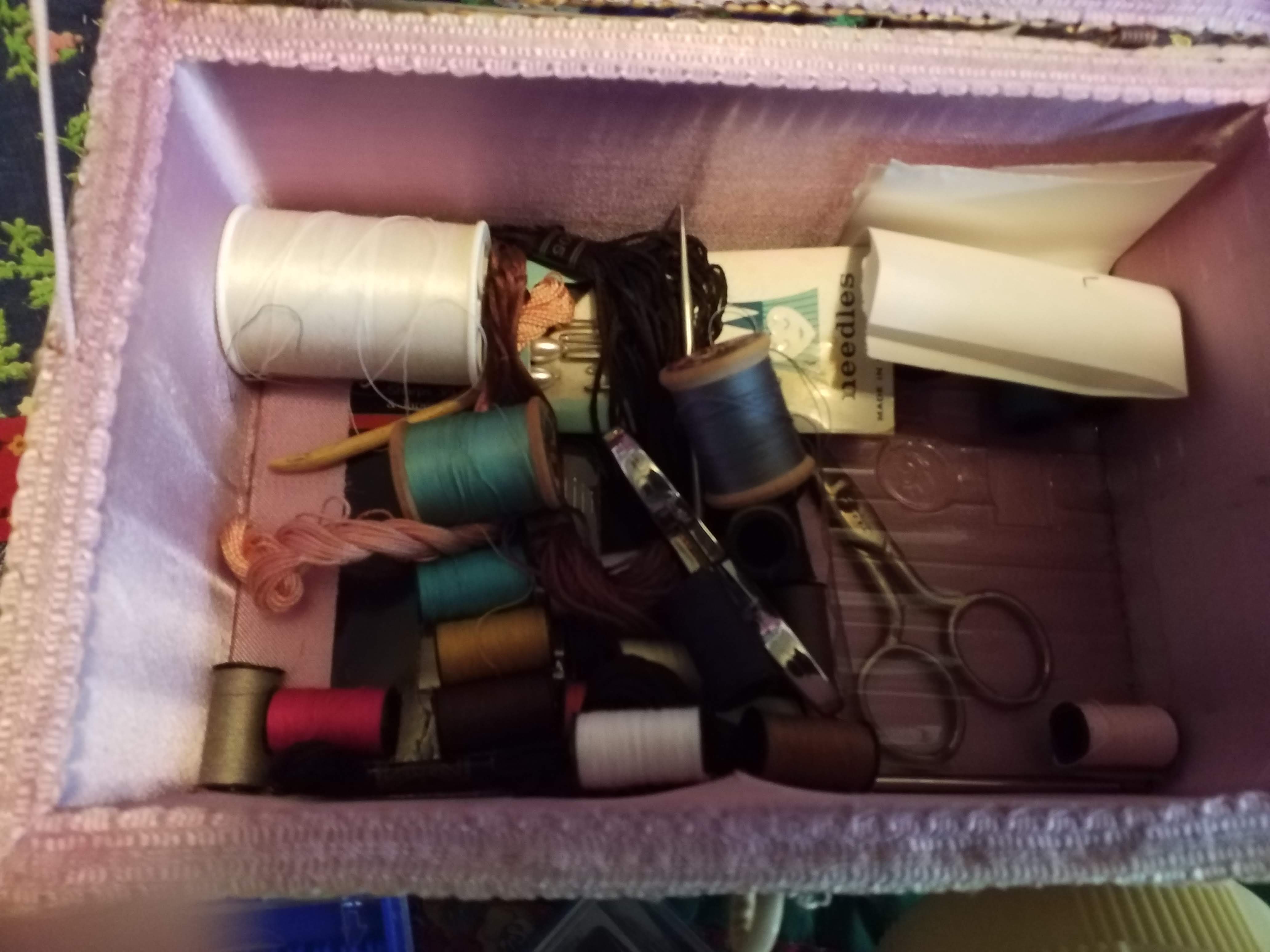 Aunt Annie's sewing box open with spools and tools