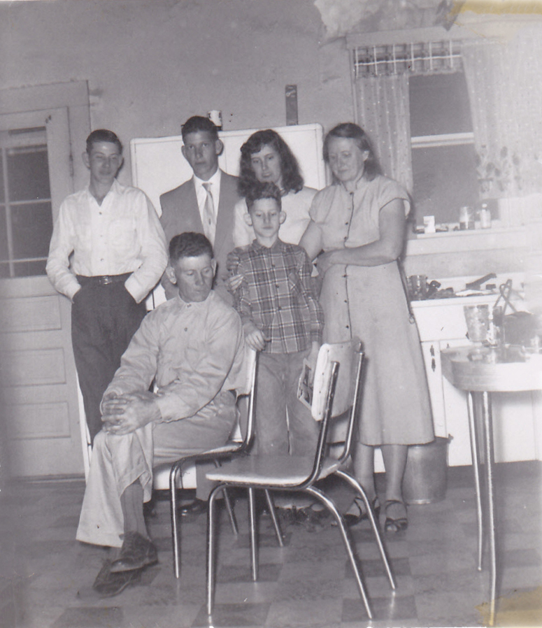 Hazel with children and Matt in kitchen