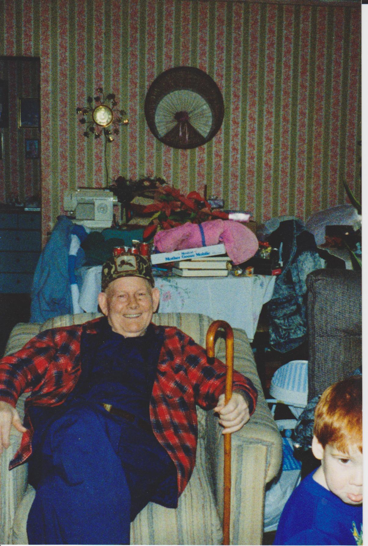 Matt Rogers smiling in chair