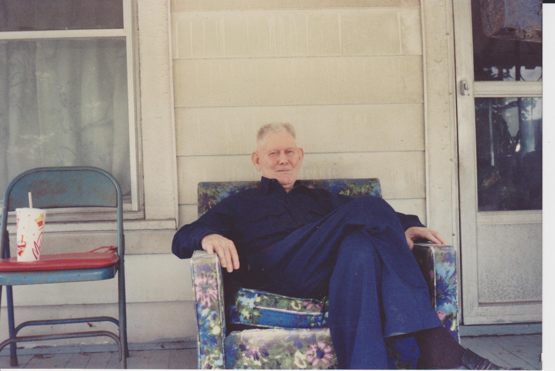 Matt Rogers sitting on porch