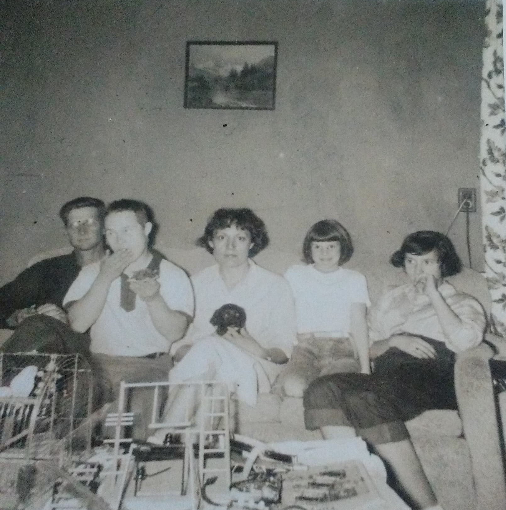 Elmer and Mary Doan with children Gilbert, Pamela, and Virginia, seated on a couch