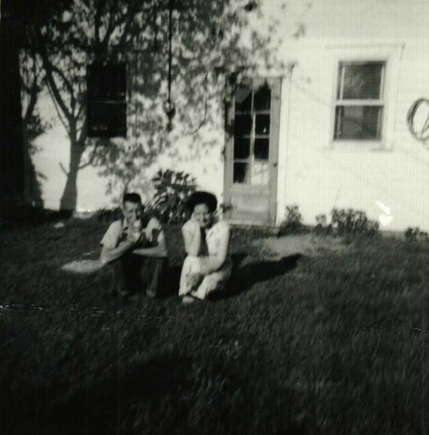 Elmer and Mary Doan sitting in the yard in July 1960
