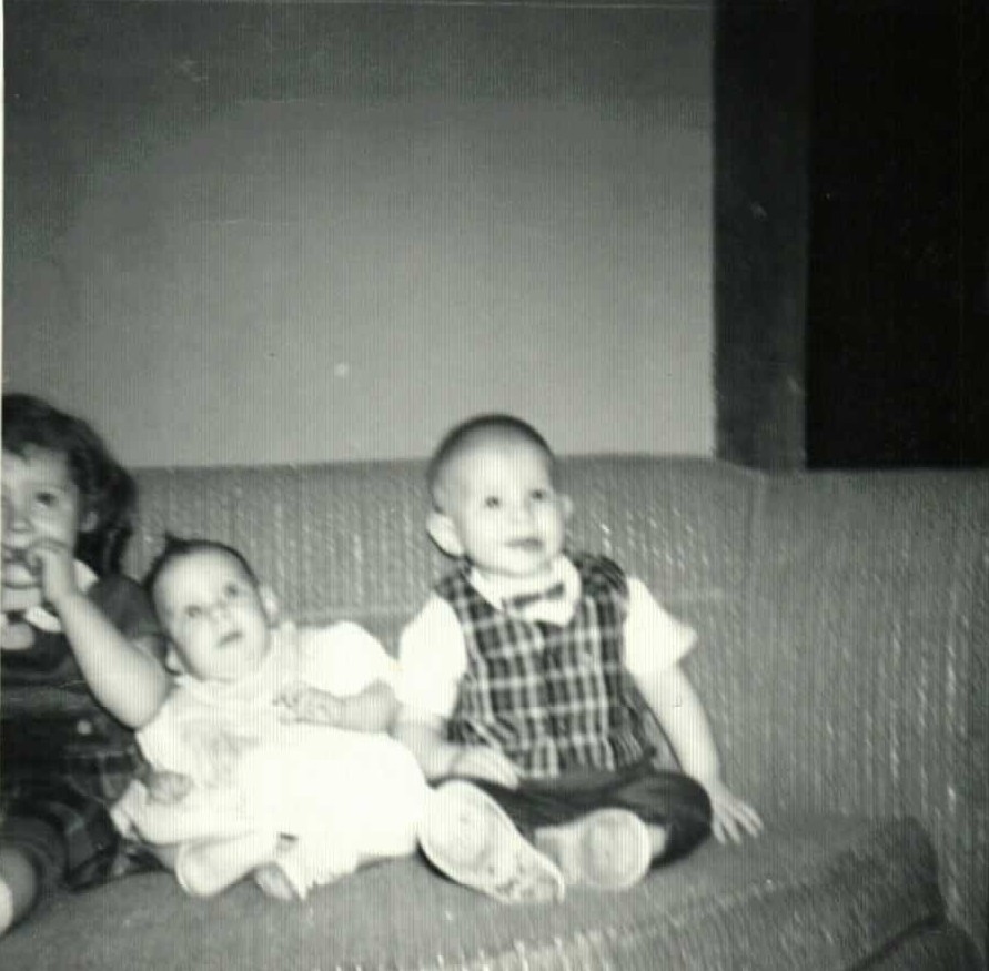 Mischelle, Rebecca, and Phillip Doan on the couch