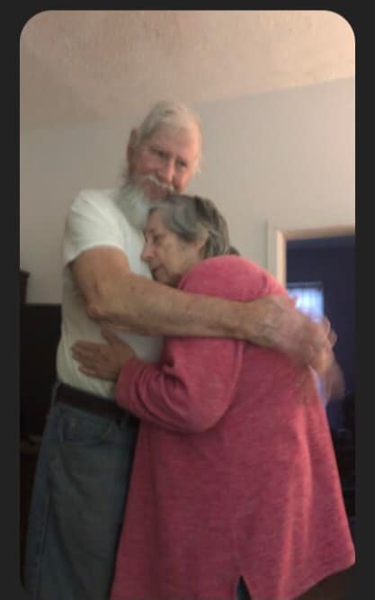 Virginia and Ishmael hugging tightly
