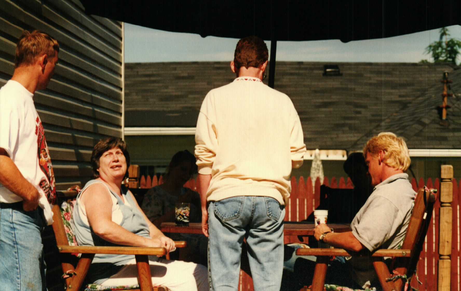 Mom on the back porch with family