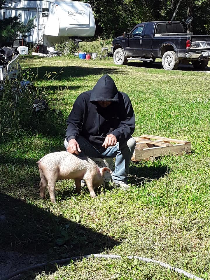 The feller sitting and petting Sally