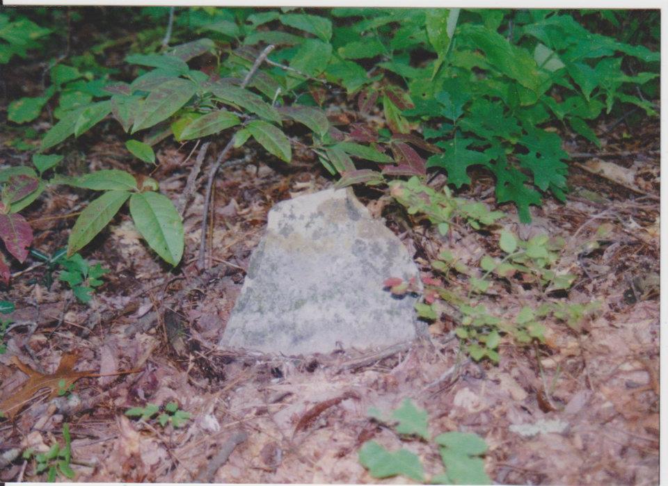 A simple weathered stone marker